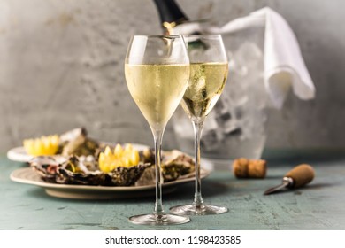 beautiful appetizer oysters and glasses champagne