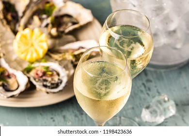 beautiful appetizer oysters and glasses champagne