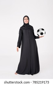 Beautiful Arab Girl Holding And Playing With Soccer Ball On White Background