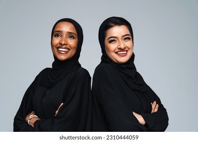 Beautiful arab middle-eastern women with traditional abaya dress in studio - Arabic muslim adult female portrait in Dubai, United Arab Emirates - Powered by Shutterstock