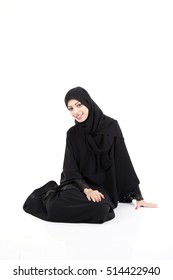 Beautiful Arab Woman Sitting On The Floor Isolated On White Background