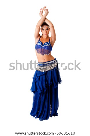 Beautiful Arabic belly dancer harem woman in blue with silver dress and head jewelry with gem dancing arms in air, isolated.