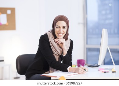 Beautiful Arabic Business Woman Working On Computer. Woman In Her Office,shallow Depth Of Field