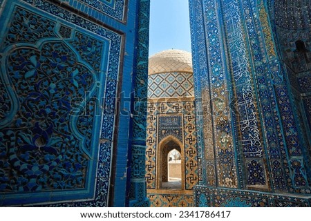 Beautiful Arch entrance of Historical cemetery of Shahi Zinda with finely decorated by blue and turquoise stone mosaic mausoleums in Samarkand, Uzbekistan.