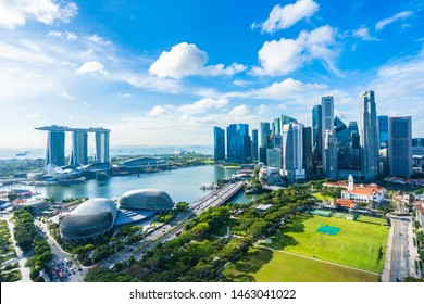 Beautiful architecture building exterior cityscape in Singapore city skyline with white cloud on blue sky