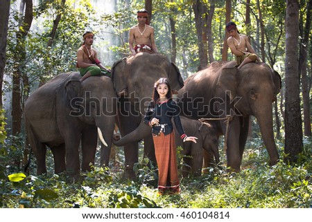 Beautiful asia woman and many elephants.