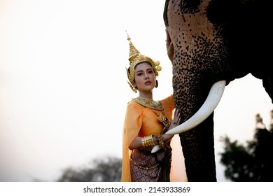 Beautiful Asia Women With Traditional Dress Portrait With Elephant , Relation Ship Between Human And Elephant.