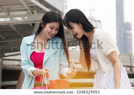 Beautiful Asia Women walking shopping in the city.