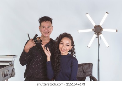 A Beautiful Asian Actress, Celebrity Or Model Posing With Her Personal Makeup Artist Backstage At The Studio.