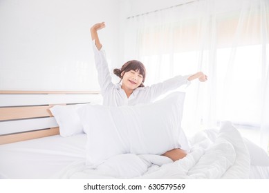 Beautiful Asian Boy Waking Up In Bedroom