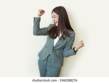 Beautiful Asian Business Woman Yelling Happy With Blazer                         