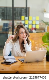 Beautiful Asian Businesswoman, Professional Millennial Woman Or Female Financial Analyst Working On Financial Graphs And Chart Data In The Office.