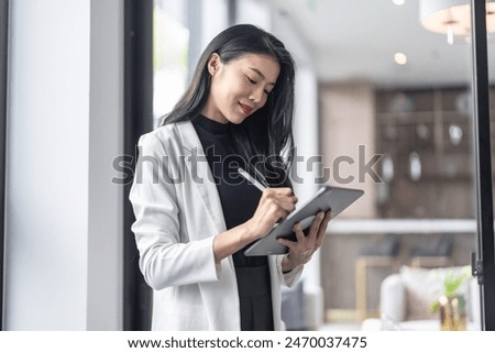 Beautiful asian doctor Education profession doctor in white uniform gown coat Professional medical doctor with tablet at seminar or hospital wellness center.