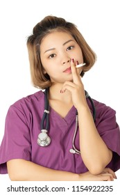 Beautiful Asian Doctor Or Nurse Smoking A Cigarette Isolated On A White Background