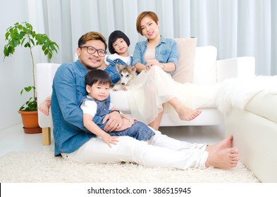 Beautiful asian family relax in the living room - Shutterstock ID 386515945