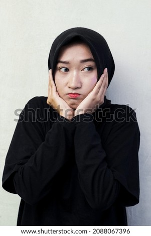 Beautiful asian female model isolated on a white background.