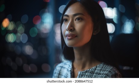 Beautiful Asian Female Portrait Standing On City Street With Neon Lights Late In The Evening. Authentic Adult Confident Woman Posing For Camera, Smiling In The Night On Downtown Business Street.