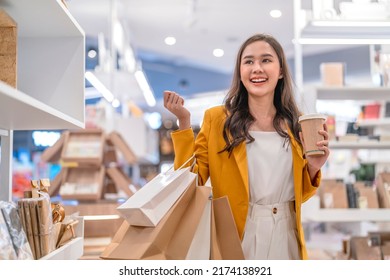Beautiful asian female woman girl is holding shopping bags and coffee drink, walk and cheerful enjoy smiling while doing shopping in female boutique department store malls happiness window shopping - Shutterstock ID 2174138921