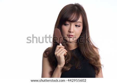 Beautiful asian girl with big eyes  eating or holding  a ice cream on white background