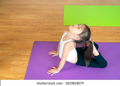 Beautiful Asian Girl Doing Yoga Poses Workout Exercise For Relaxing And Meditating At Home. Asia, Yoga, Zen, Sport, Fitness. Healthy, Home Activity Or Asian Woman Concept