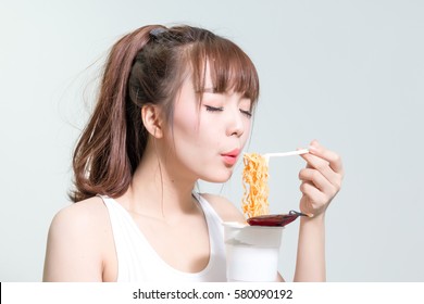 Beautiful Asian Girl Eating Instant Noodle