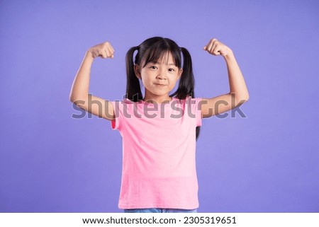 beautiful asian girl portrait posing on purple background