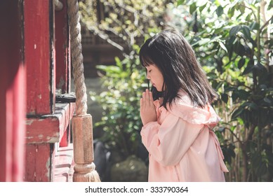 Beautiful Asian Girl Is Praying At The Shrine,vintage Filter