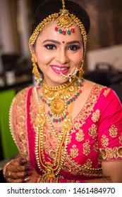 Beautiful Asian Indian Bride Wearing Ethnic Traditional Outfit And Heavy Gold Jewellery Necklace Smiling Wedding Day