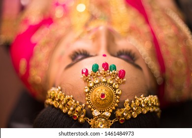 Beautiful Asian Indian Bride Wearing Ethnic Traditional Outfit And Heavy Gold Jewellery Necklace Head Shot Wedding Day