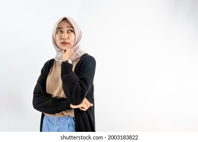 Beautiful Asian Muslim Woman With Serious Expression Looking At Empty Space Isolated On White Background, Advertising Concept