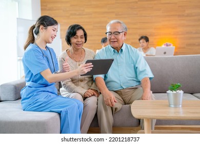 Beautiful Asian nurse or doctor use tablet to consult and give assistant to couple senior man and woman in living room of clinic or hospital in senior healthcare center. - Powered by Shutterstock