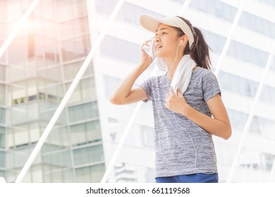 Beautiful Asian Sport Girl Wiping Sweat With Towel In City, Sport People Concept.