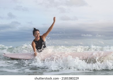 Beautiful Asian Surfer Girl With Surfboard Fun To Surf The Big Waves, Surfing Time, Summer Holidays Travel 