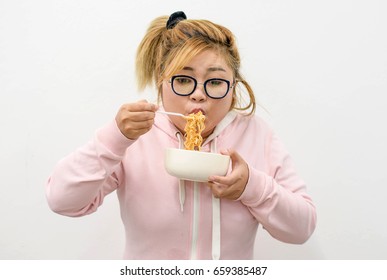 Beautiful Asian Teen Girl Eating Noodles On The White Background Beautiful Asian Teen Girl Eating Noodles On The White Background