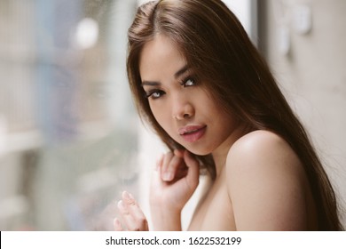 Beautiful Asian Teenager Posing Indoors