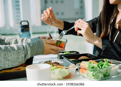 Beautiful Asian Thai Long Dark Hair Woman In Black Formal Shirt Having Lunch With Business Partner In Office.