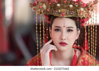 Beautiful Asian Woman In Chinese Vintage. Beautiful Asian Woman Wearing Red Period Wedding Costume