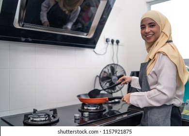  Beautiful Asian Woman Cooking At Kitchen