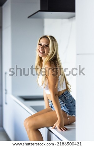 Similar – Blonde young caucasian woman smiling on steps