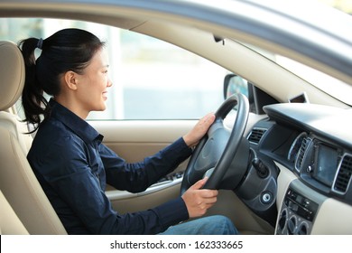 Beautiful Asian Woman Driving A Car 