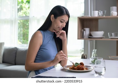 Beautiful Asian Woman Eating Pasta On Table In The Morning At Home. Smiling Healthy Woman Eating Spaghetti While Sitting And Having Breakfast At The Kitchen Table.