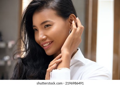 Beautiful Asian Woman. Happy Young Girl Touch Her Clean Skin And Looking Away. Concept Of Face Skin Care And Beauty 