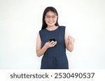 Beautiful Asian Woman Holding Smartphone Pointing down Isolated On White Background