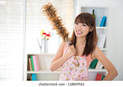 Beautiful Asian Woman Housekeeping With Cleaning House