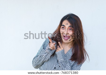 Beautiful asian woman make up face joke on white background,Thailand people pose for take a picture