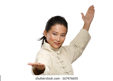 Beautiful Asian Woman Make Kung Fu Gesture  On White