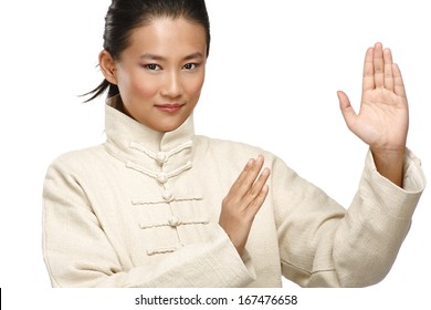 Beautiful Asian Woman Make Kung Fu Gesture  On White