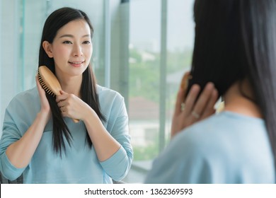 Beautiful Asian Woman Makeup And Hair Set Wirh Mirror In Bathroom With Morning Light