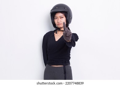 beautiful asian woman with a motorcycle helmet open hand doing stop sign with serious expression defense gesture isolated on white background
 - Powered by Shutterstock