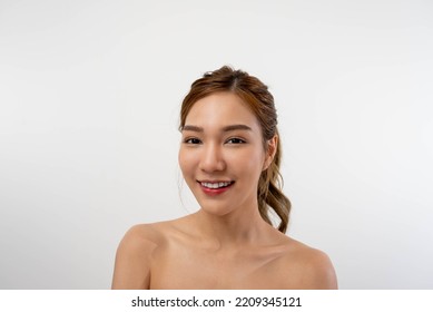 Beautiful Asian Woman, Natural Cosmetic Skincare Products Look At Camera, Smiling, Touching Face And Healthy Skin In Slow Motion, Wellness. Beauty Portrait.